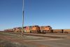Two trains full of iron ore are waiting to get to the doc